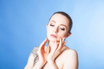 Fototapeta premium portrait of a young woman with soft skin after Spa treatments and cosmetics