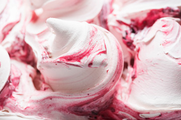 Cherry flavour gelato - full frame detail. Close up of a white surface texture of Cherry Ice cream covered with red stripes