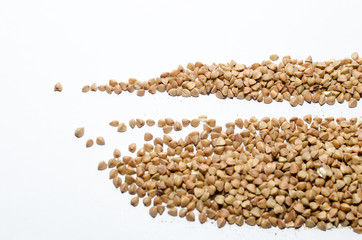 buckwheat groats on a light background, closeup texture