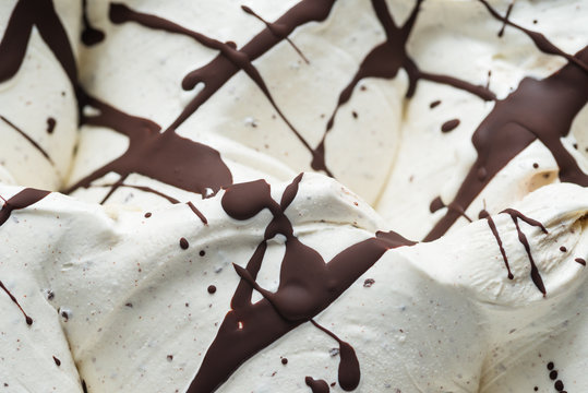 Stracciatella flavour gelato - full frame detail. Close up of a white surface texture of stracciatella Ice cream covered with chocolate stripes and dots
