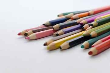 blunt colored pencils on a white background, sharpened pencil lead on a light background, close-up