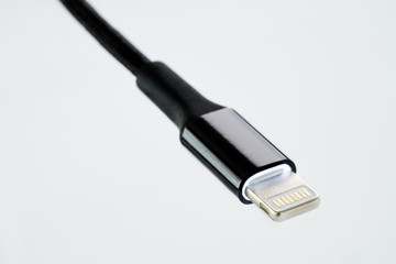Black USB lightning smartphone charging and data connector.