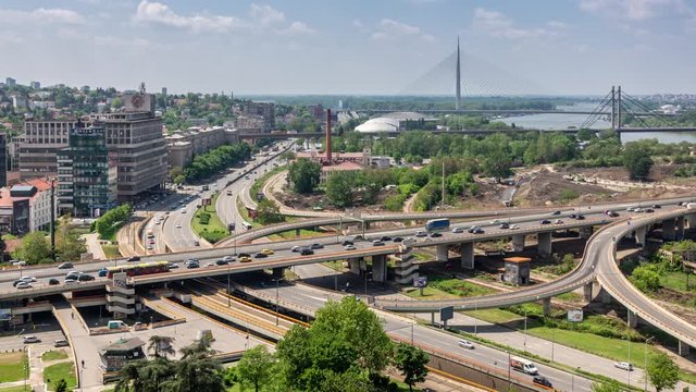 Aerial view of Mostar interchange in Belgrade, Serbia. Car traffic. Time lapse video. Sunny spring afternoon.