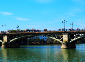 Fototapeta na wymiar View of the Isabel II Bridge (popularly called Puente de Triana) in Seville, Spain.