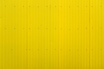 Yellow metal decking. Sheets of yellow corrugated iron