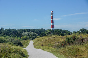 Fototapeta na wymiar The red white lighthouse of the abandoned Ameland in the Netherlands