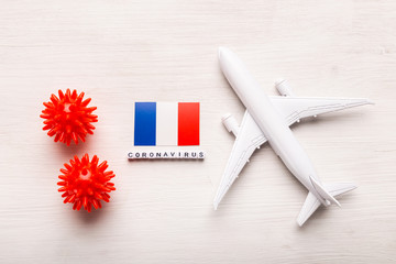 Plane model and flag France. Coronavirus pandemic. Flight ban and closed borders for tourists and travelers with coronavirus covid-19 from Europe and Asia.