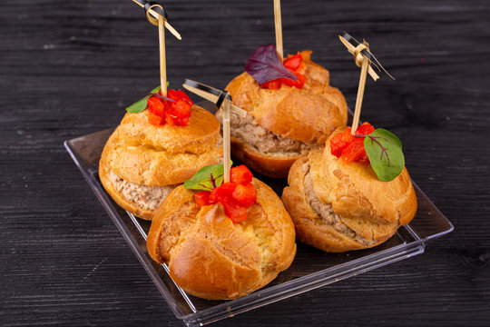 Canape with a pate of chicken, beef and duck, served in ecklers with greens