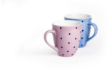 Two dotted tea cups isolated on white background