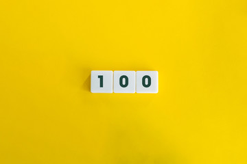 Number hundred (100) on block letters, on the yellow  background. Minimal Aesthetics.