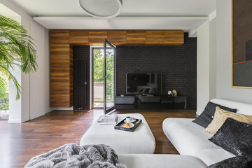 Fototapeta na wymiar Living room with black brick wall