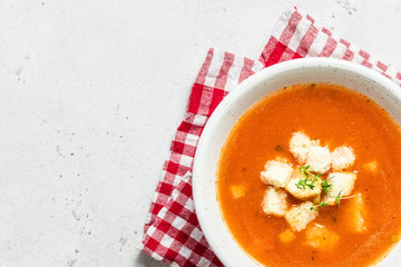Basil parmesan tomato soup. Top view, copy spce.