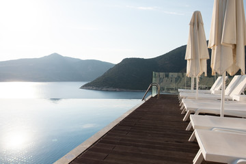 Empty hotel sun beds near the pool