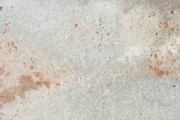 Natural stone of gray and yellow spots color with a chipped uneven texture background