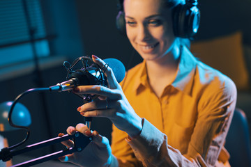 Young radio presenter working at the radio station