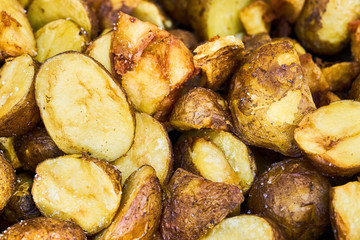 Fried baby potatoes in a frying pan. Top view
