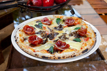 Parma ham pizza with mushrooms