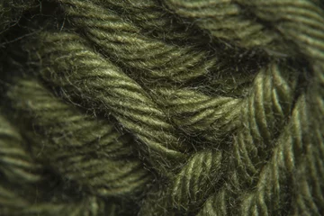Fotobehang Close-up macro shots a green wool thread on the wool thread ball © whitepointer
