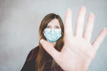 Young woman wearing a protective face mask