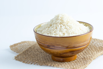 Close up a bowl of uncooked long grain white rice