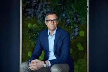 Portrait of confident businessman in green office
