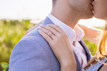 Romantic engagement. beautiful couple. kiss of love. engagement ring. celebration of love and happiness 