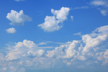 Naklejka na ściany i meble Background of blue sky with clouds. Blue, white pastel paradise, soft focus lenses, glare of sunlight. Abstract blurred blue gradient of a peaceful nature. View from the windows of a beautiful summer