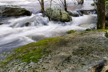 River rushing through boulders creating a waterfall