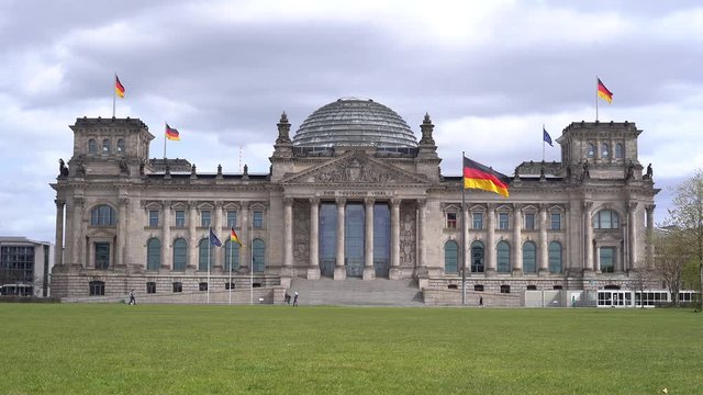 berlin, germany, beautiful view of the famous Reichstag building at a sunny day, meeting place of the German parliament, modern Bundestag, deserted square in front of the building 4K