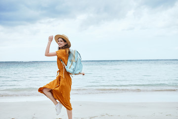 Woman hiker walk backpack beach horizon island
