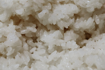 boiled long grain rice for sushi rolls close-up background