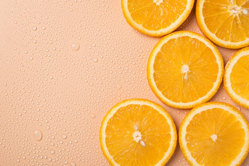 Sunny summer concept. Top above overhead close up view photo of juicy orange slices on table with...