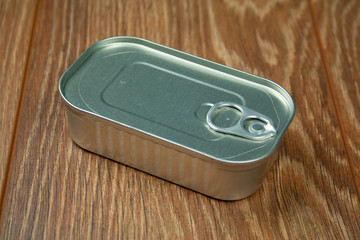 Tin can closeup isolated on wooden background