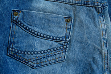 Fototapeta premium Close up of blue jeans back pocket