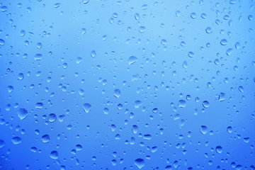 Raindrops water drop on window glass