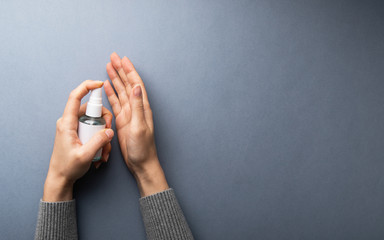 Health care hygiene protection prevention against virus, bacteria, flu and coronavirus, covid - 19 by disinfection hands with alcohol antiseptic spray sanitizer.	
