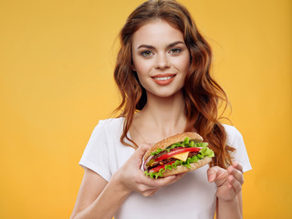 Cheerful woman hamburger fast food meal diet diet snack