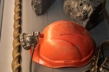 Miner's helmet with iron and rocks