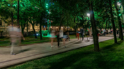 People walking in the summer evening on the city Boulevard