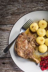 Roasted duck leg.