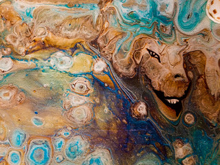 Paint pouring design with dragon face