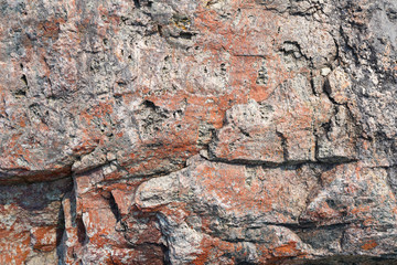 Texture of natural rock granite natural rock granite, magmatic structure with quartz and mica and traces of erosion.