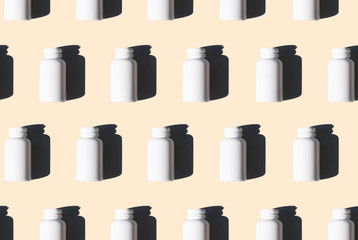 white medicine bottles pattern on beige background