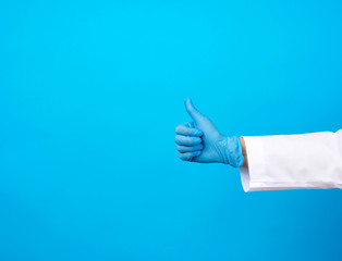 doctor in a white coat shows with his hand a gesture like