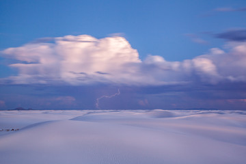 Lightening strikes across the desert sand dunes