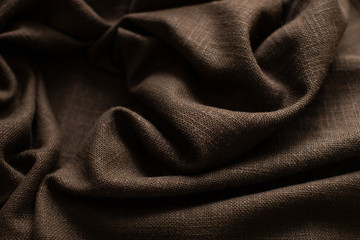 Background from brown linen. Fabric texture