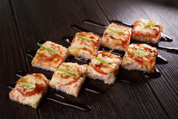 Sushi set on a dark brown table