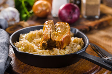 Traditional spare ribs baked in sauerkraut.