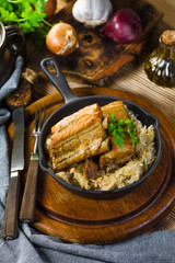 Traditional spare ribs baked in sauerkraut.