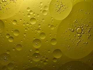 Abstract bubble background in yellow. Slightly blurred and selective focus.